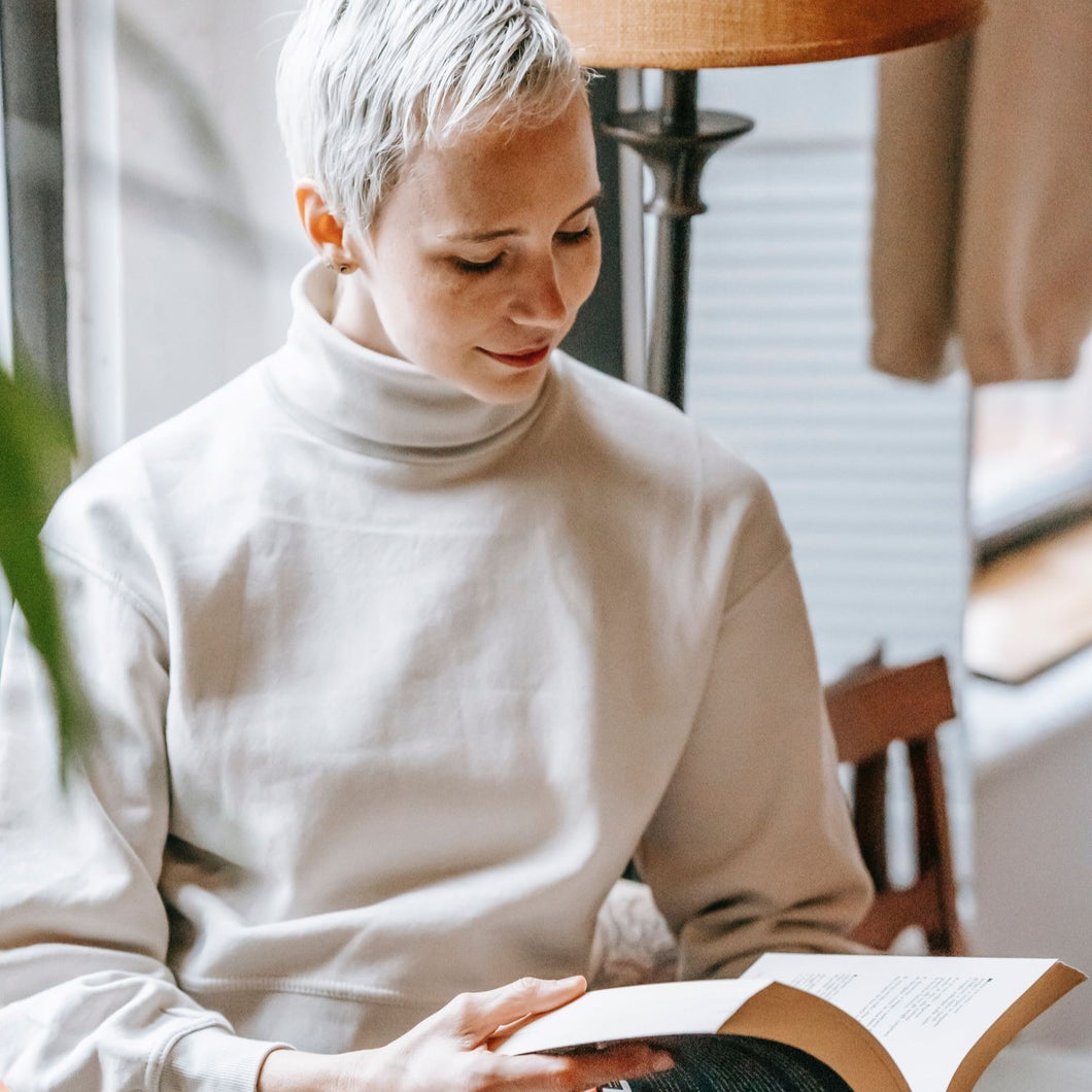 Young woman studying from a textbook